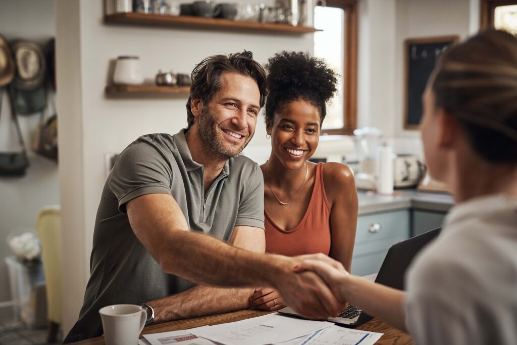 handshake and couple with a financial advisor, consultation and discussion for investments.